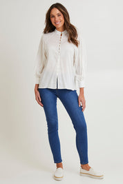Model Madeline wearing size 10 of the Berry Kiss Linen Tencel Blend Blouse in colour Ivory (White), from the front, showing the whole outfit