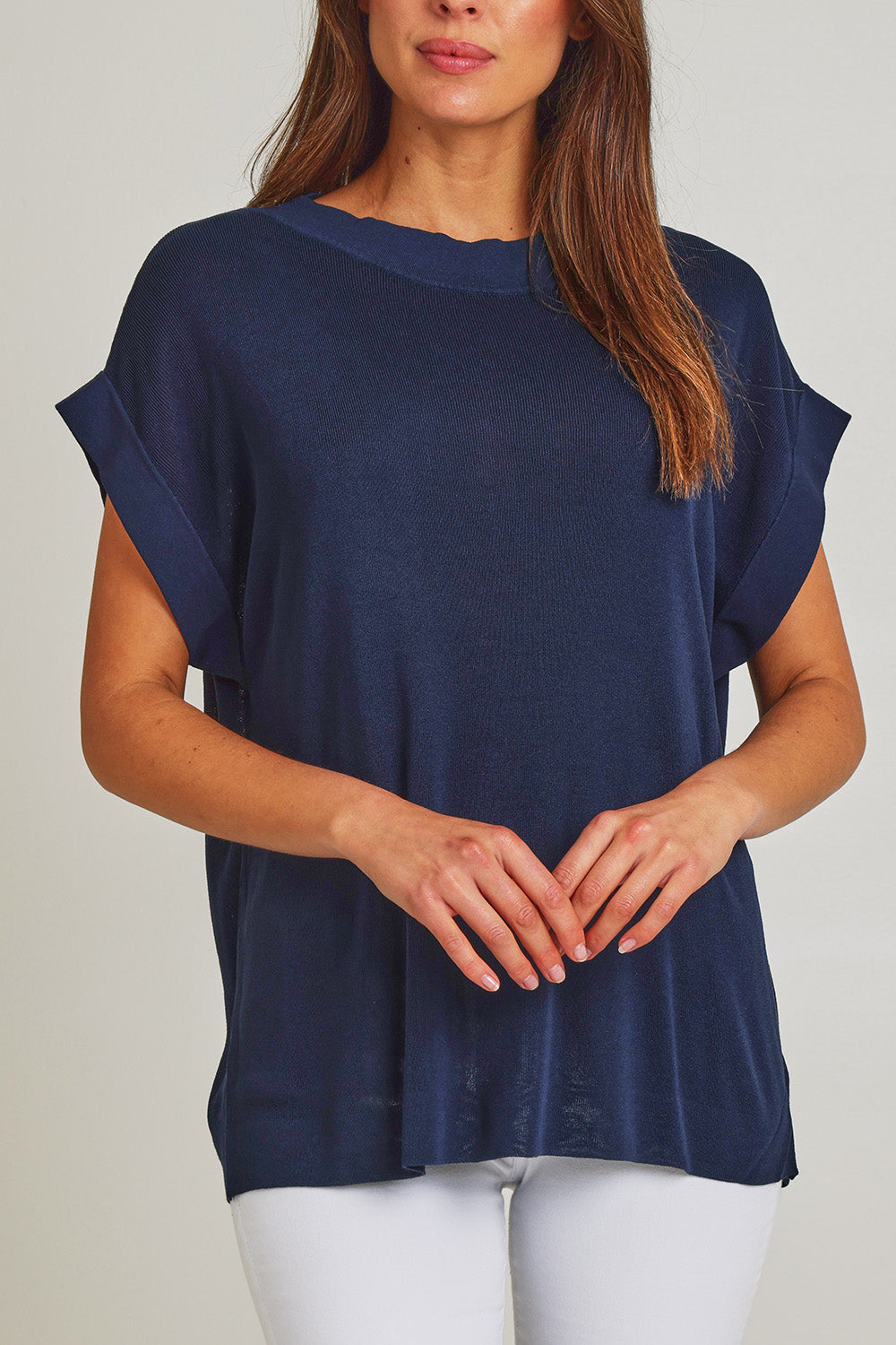 Model Madeline wearing size 10 of the Junos Knit in colour Navy (Blue), from the front, cropped image