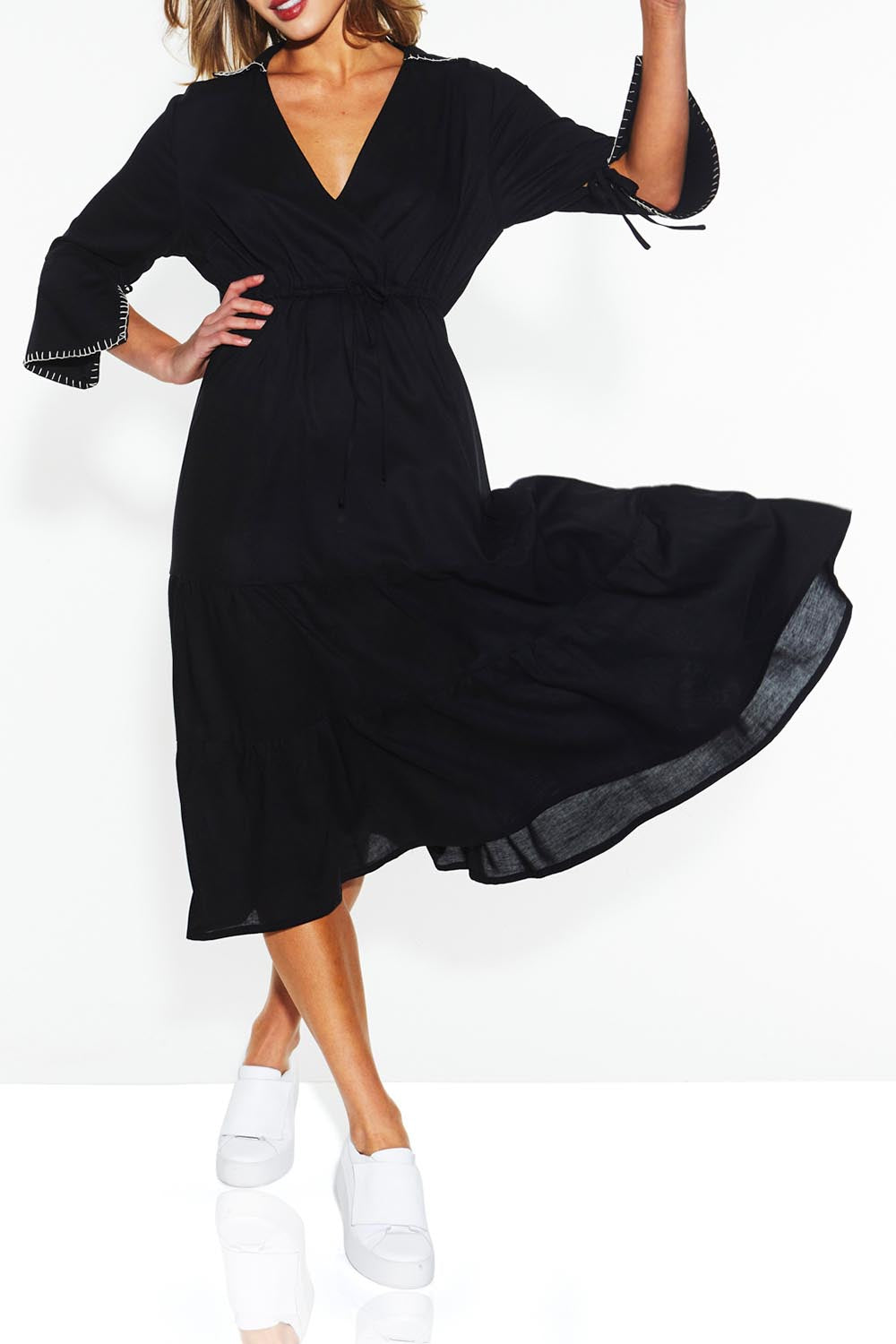 A model wearing the Showcase Tencel Blend Dress in colour Black (Black), from the front, cropped image