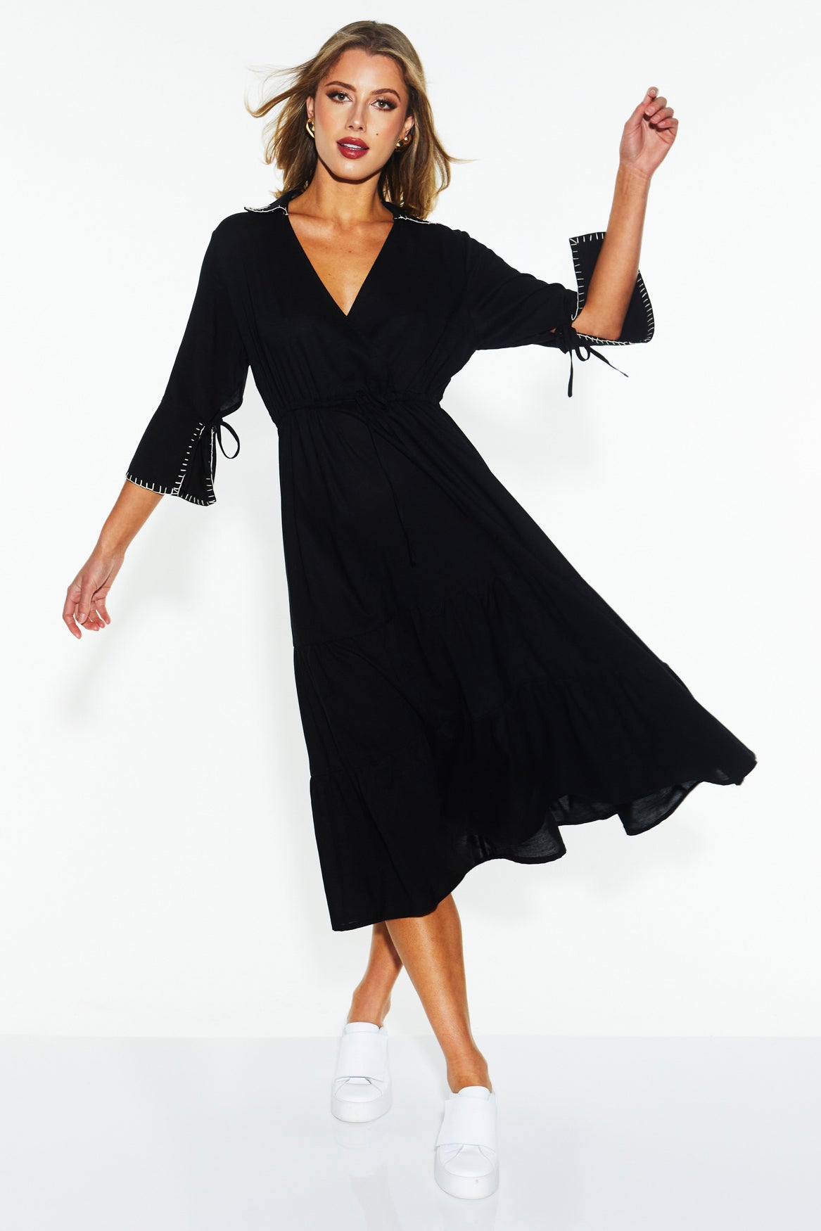A model wearing the Showcase Tencel Blend Dress in colour Black (Black), from the front, showing the whole outfit