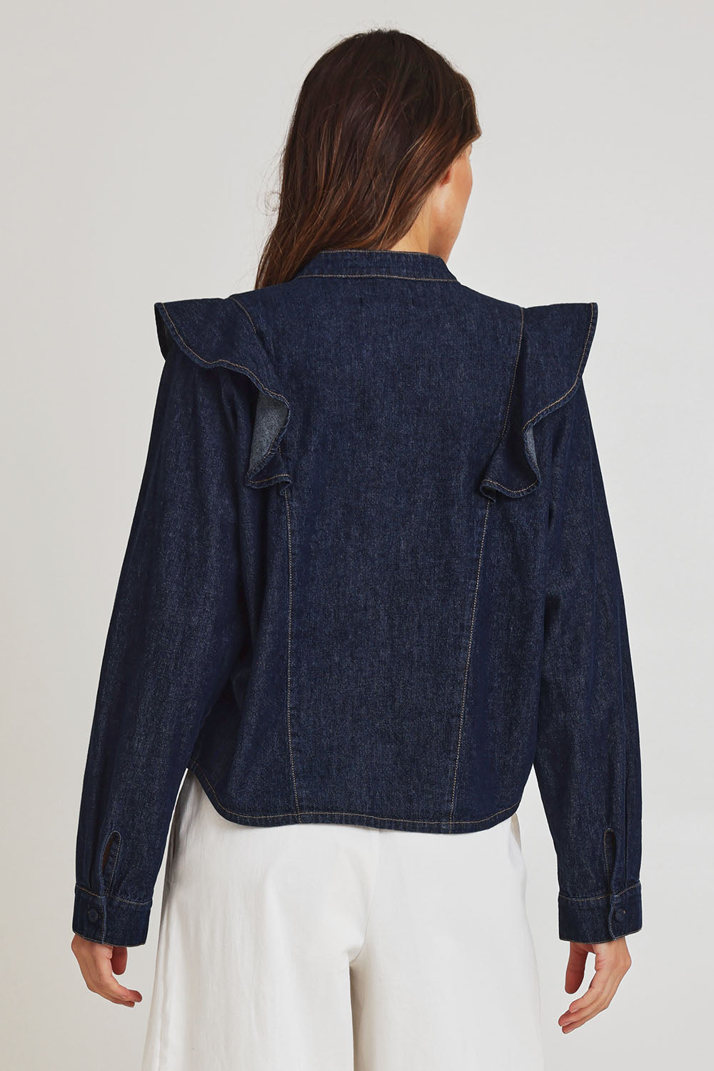 Model Madeline wearing size 10 of the Soaring Denim Shirt in colour Indigo (Blue), from the back