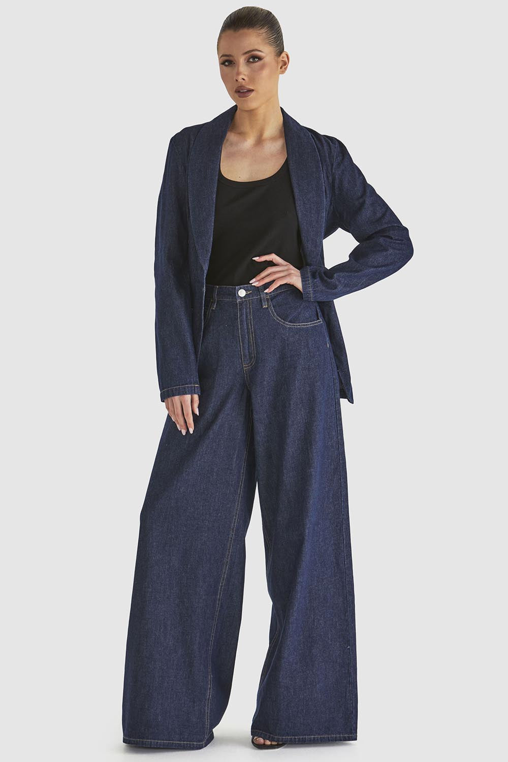 A model wearing the Soaring Denim Jean in colour Indigo (Blue), from the front, showing the whole outfit