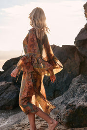 A model wearing the Bohemian Lyocell Dress in colour Floral, from the front, showing the whole outfit