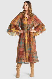A model wearing the Bohemian Lyocell Dress in colour Floral, from the front, showing the whole outfit