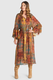 A model wearing the Bohemian Lyocell Dress in colour Floral, from the front, showing the whole outfit