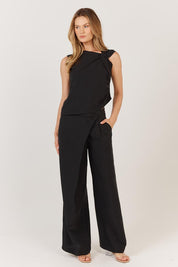 A model wearing the Sandara Top in colour Black (Black), from the front, showing the whole outfit