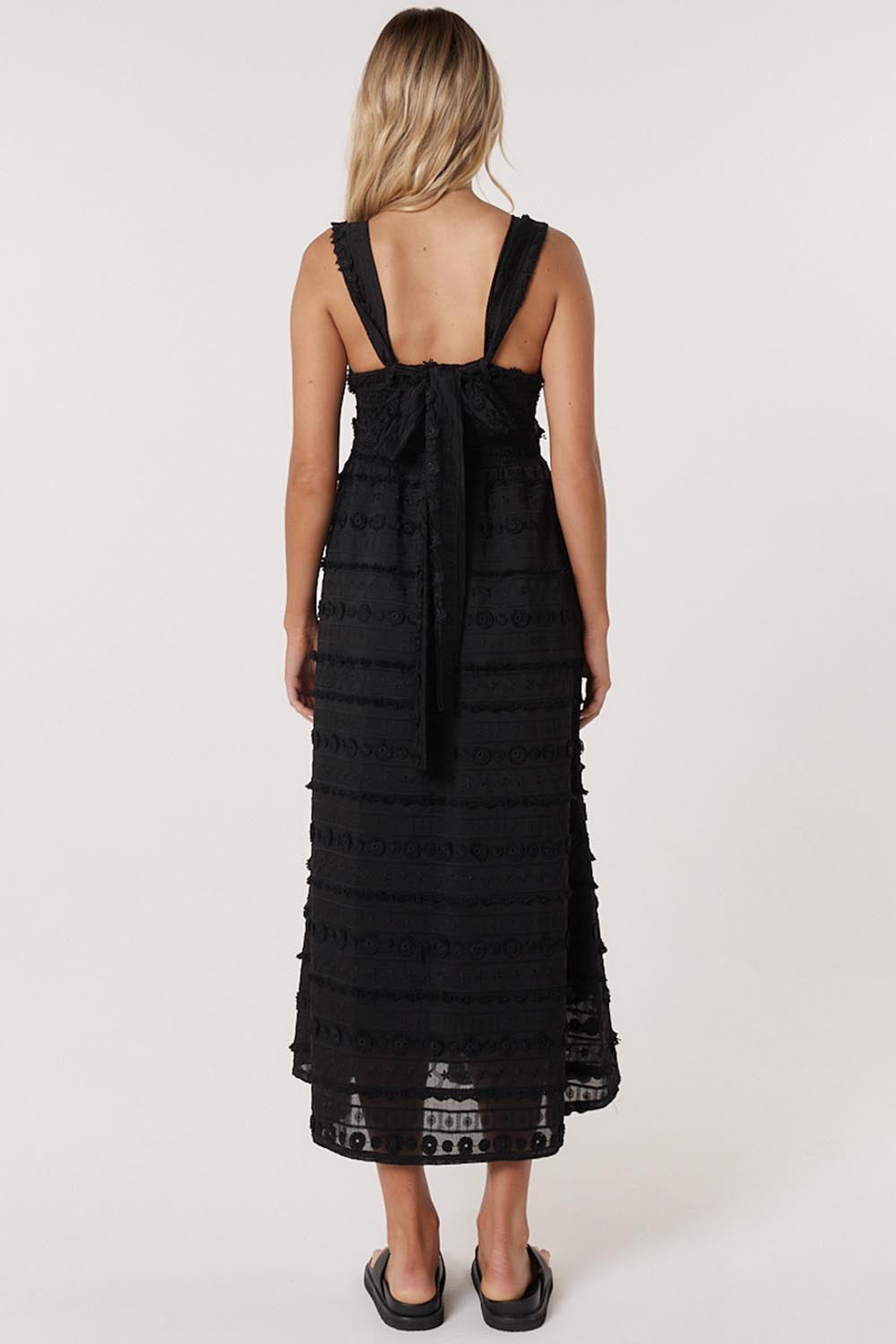A model wearing the Sierra Lyocell Blend Lace Dress in colour Black (Black), from the back