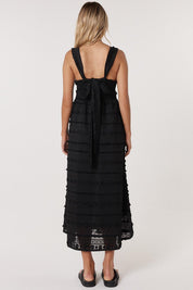 A model wearing the Sierra Lyocell Blend Lace Dress in colour Black (Black), from the back