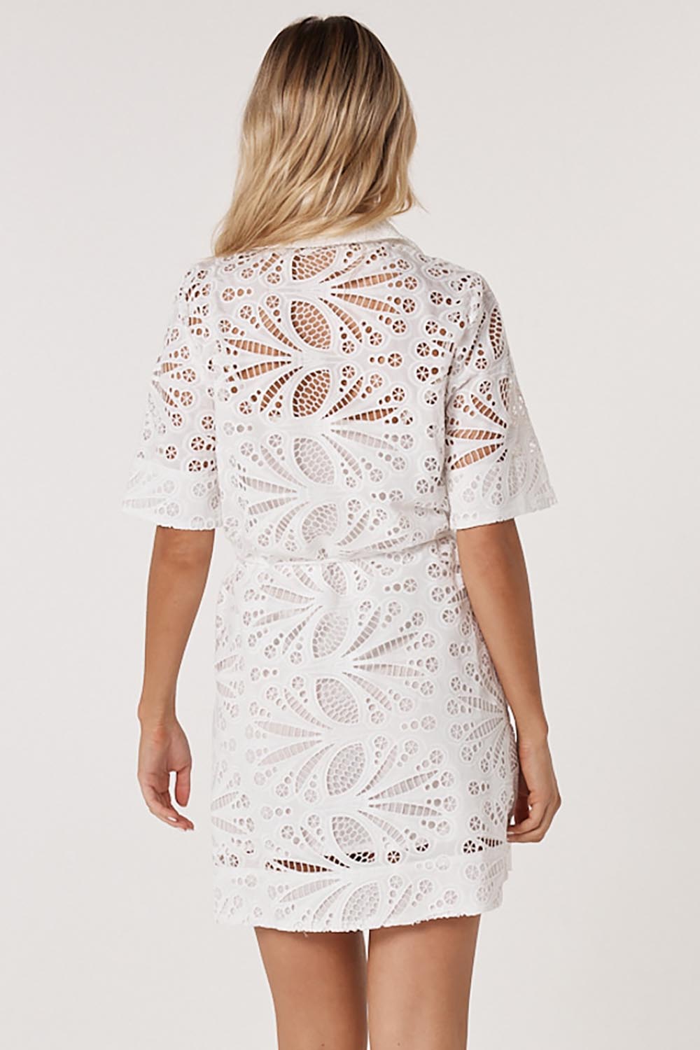 A model wearing the Elara Broderie Shirt Dress in colour Ivory (White), from the back