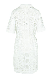 Product shot of the Elara Broderie Shirt Dress in colour Ivory (White), from the back