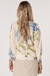 A model wearing the Anthea Linen Blend Blouse in colour Floral (White), from the back