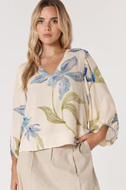 A model wearing the Anthea Linen Blend Blouse in colour Floral (White), from the front, cropped image