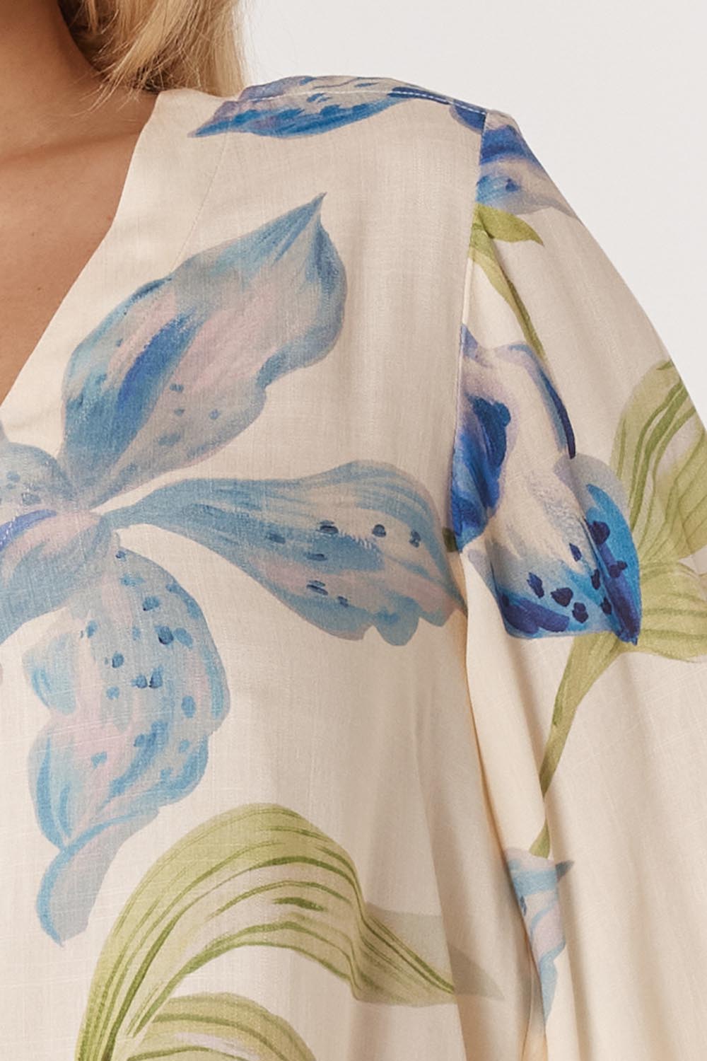 A model wearing the Anthea Linen Blend Blouse in colour Floral (White), from the front, cropped image