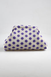 Model Genericm wearing size sample of the Bondi Spot Clutch - Whitepurple in colour Whitepurple, from an angle