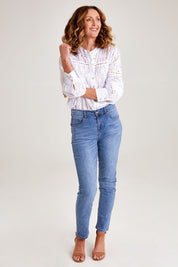 Model Emma wearing size 10 of the Marvel Jean in colour Denim (Blue), from the front, showing the whole outfit