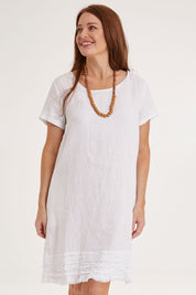Model Sally wearing size 10 of the Frilled Hem Linen Dress in colour White (White), from the front, cropped image