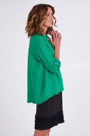Model Emma wearing size 10 of the Frill Hem Pull On Linen Skirt in colour Black (Black), from the front, cropped image
