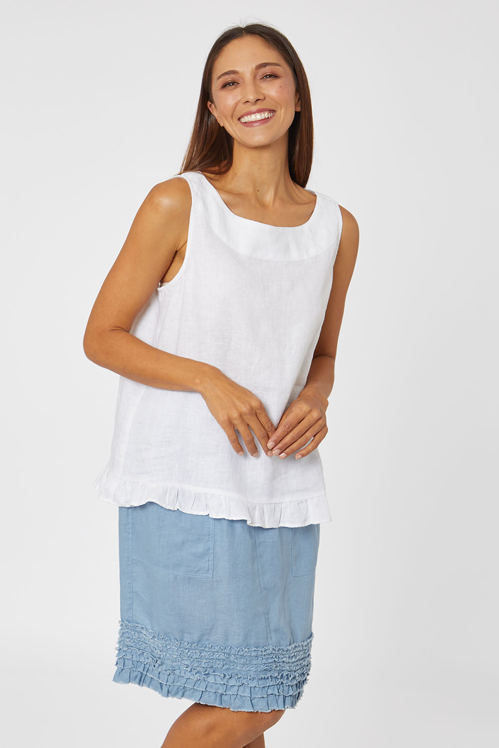 Model Cara wearing size 10 of the Frill Hem Pull On Linen Skirt in colour Powder (Blue), from the front, cropped image