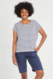 Model Aiyana wearing size 10 of the Pull On Linen Short in colour Marine (Blue), from the front, cropped image