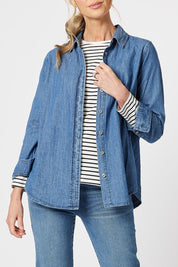 A model wearing the Denim Shirt in colour Denim (Blue), from the front, cropped image