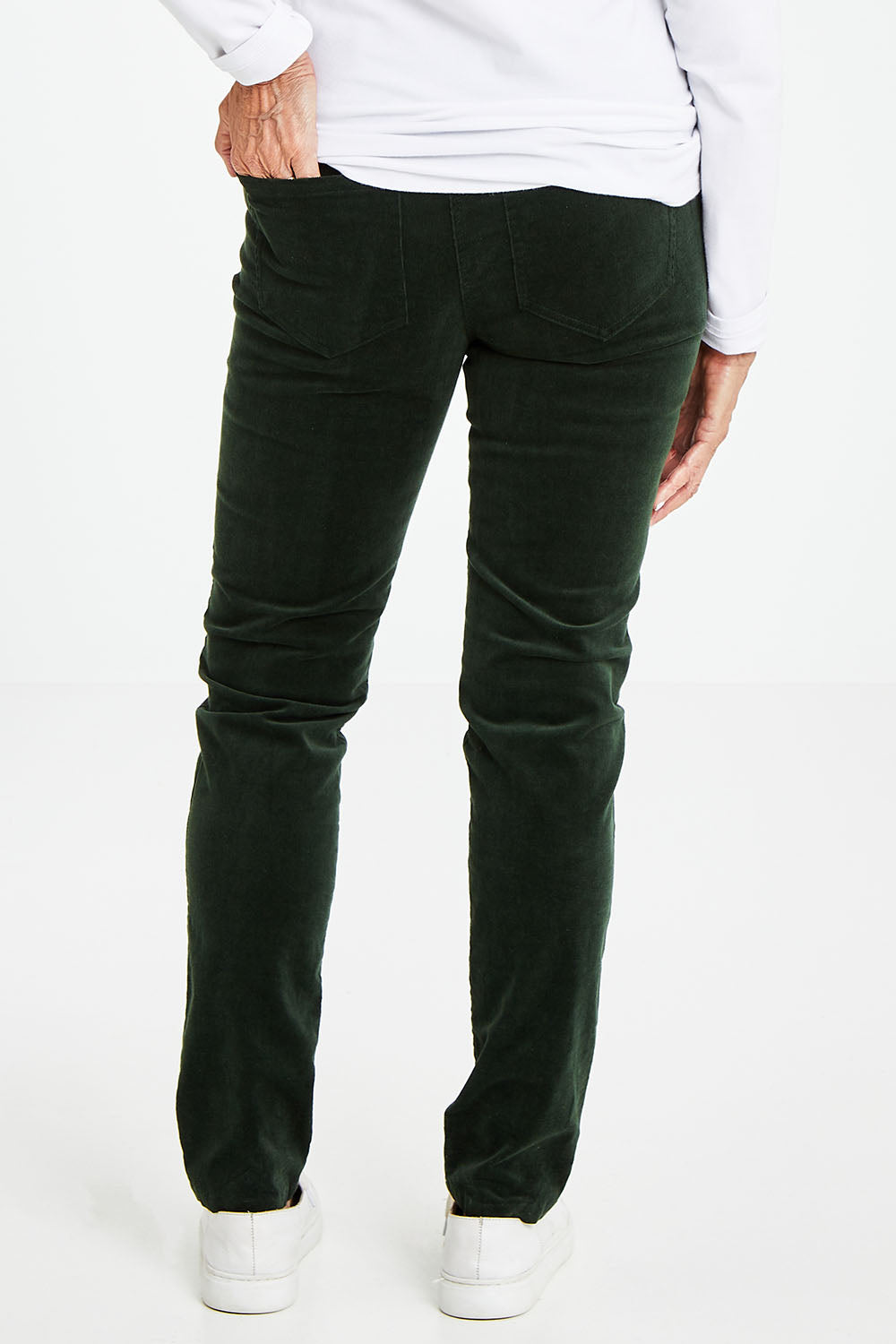 Model Elise wearing size 10 of the Stretch Pinwale Cord Pant in colour Emerald (Green), from the back