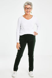 Model Elise wearing size 10 of the Stretch Pinwale Cord Pant in colour Emerald (Green), from the front, showing the whole outfit