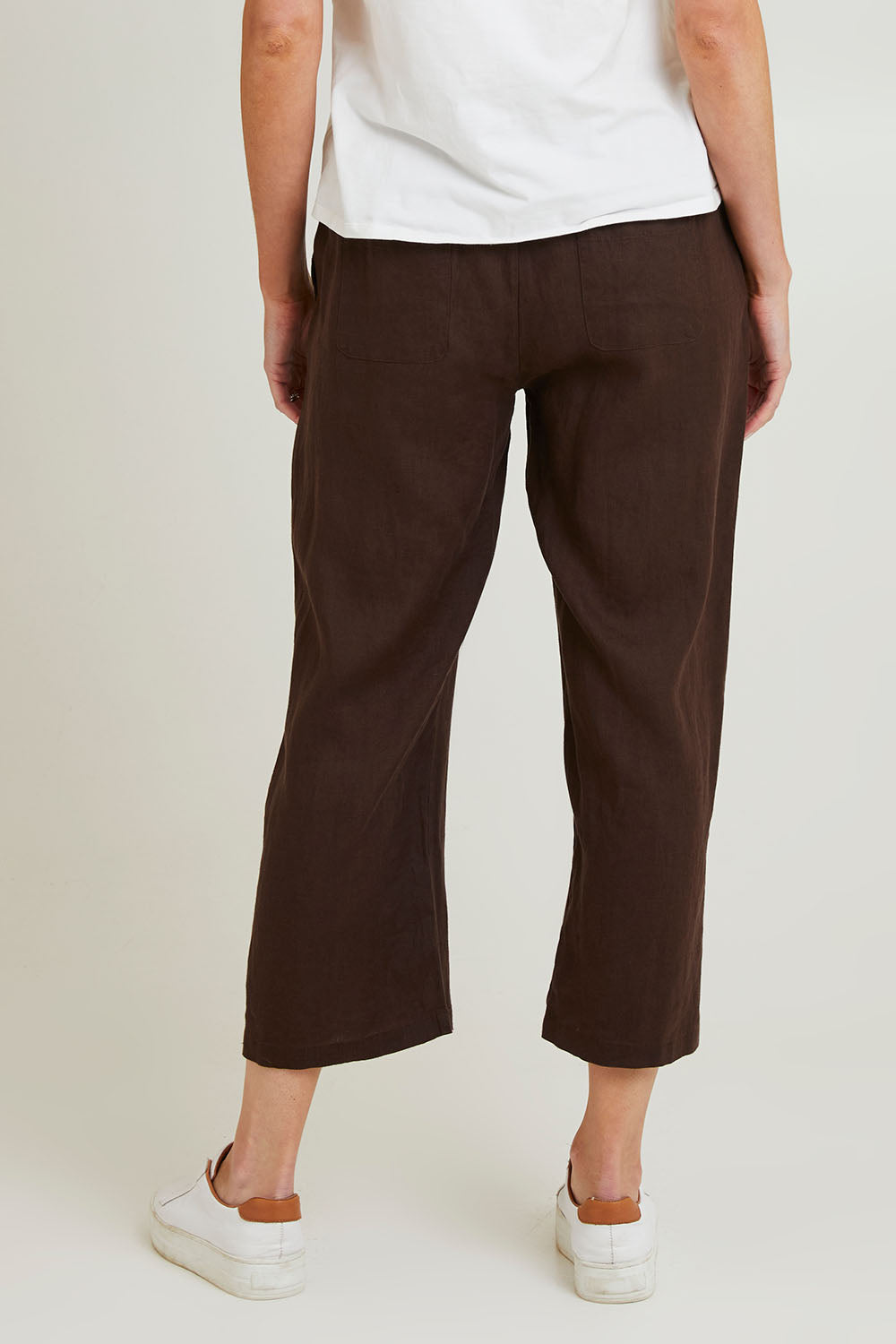 Model Grace wearing size 10 of the Classic Wide Leg Linen Pant in colour Koko, from the back