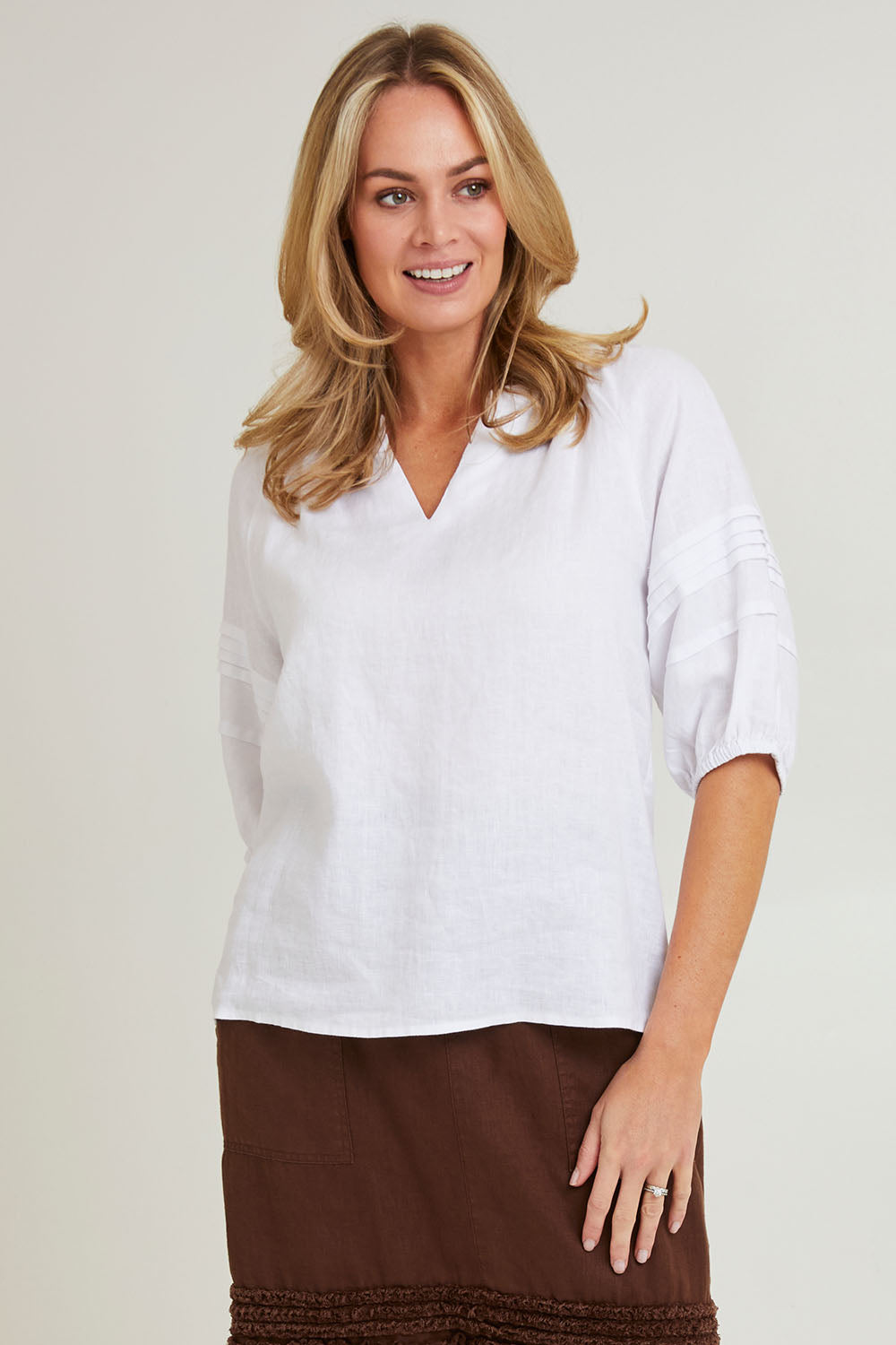 Model Grace wearing size 10 of the Diana Linen Top in colour White (White), from the front, cropped image