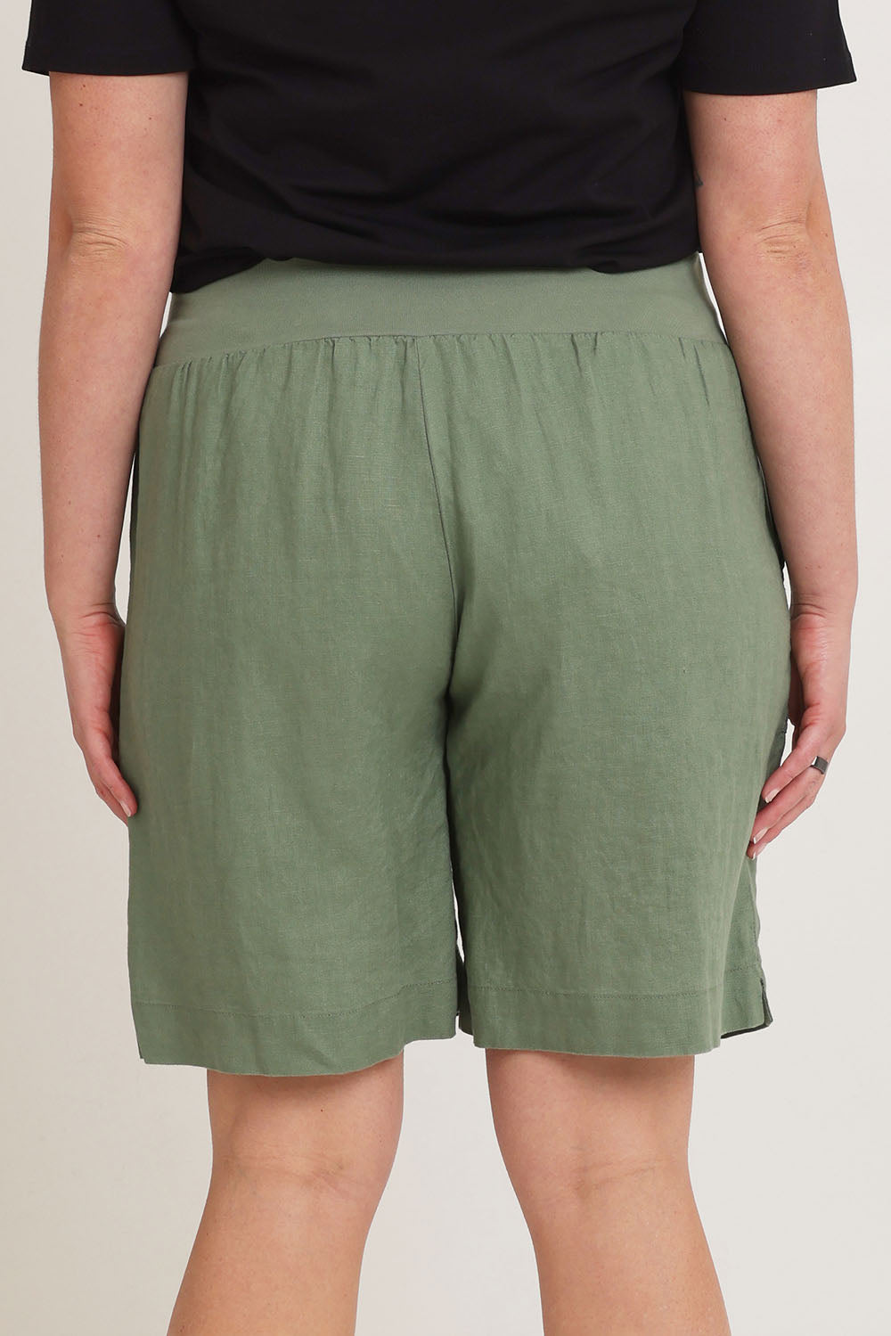 Model Chanel wearing size 16 of the Jersey Waist Linen Short in colour Khaki (Green), from the back