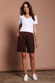 Model Madeline wearing size 10 of the Jersey Waist Linen Short in colour Koko, from the front, showing the whole outfit