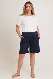 Model Chanel wearing size 16 of the Jersey Waist Linen Short in colour Navy (Blue), from the front, showing the whole outfit