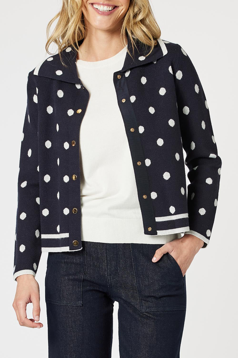 A model wearing the Ascot Cardigan in colour Navy (Blue), from the front, cropped image