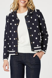 A model wearing the Ascot Cardigan in colour Navy (Blue), from the front, cropped image