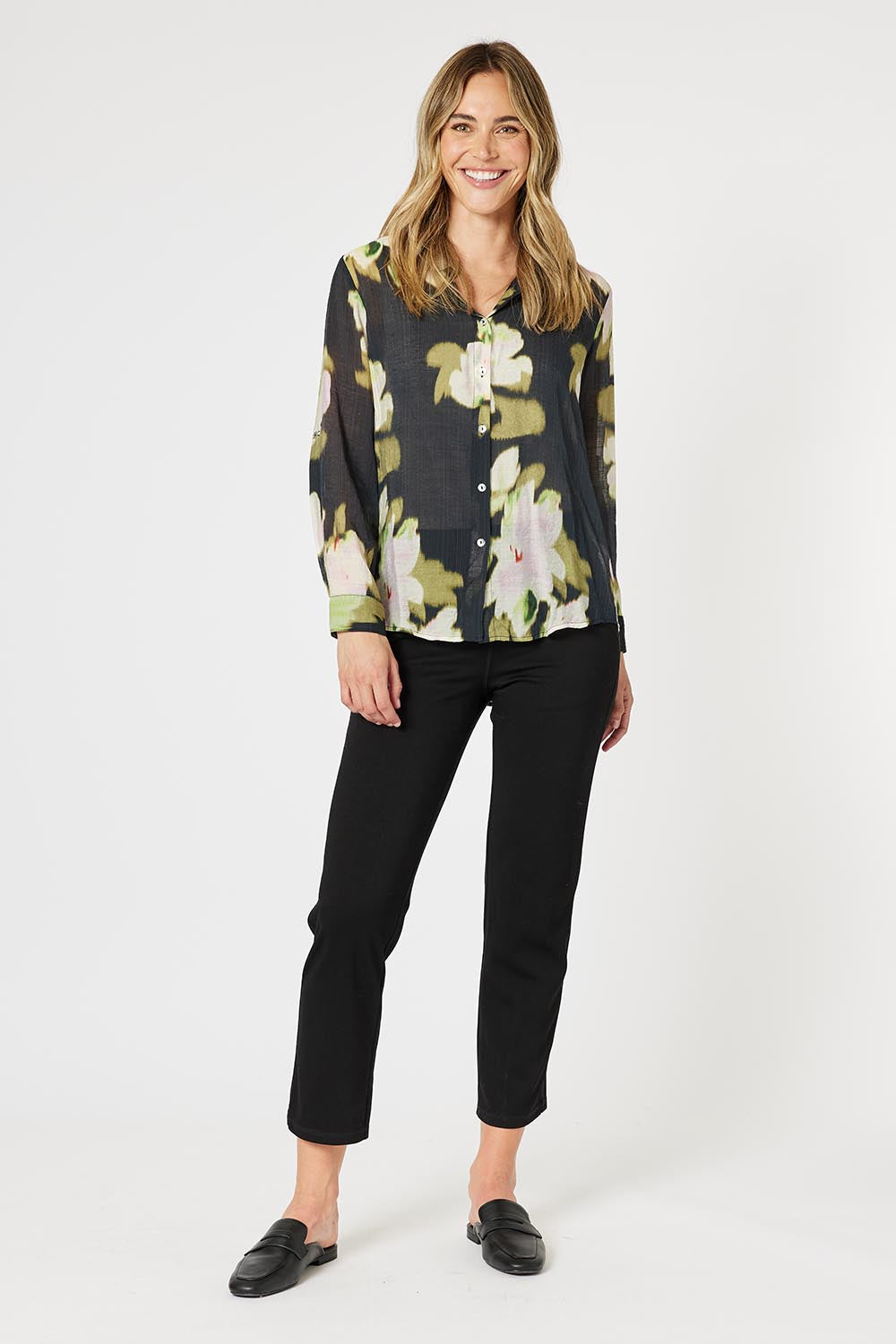 A model wearing the Maggie Shirt in colour Black (Black), from the front, showing the whole outfit