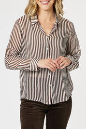 A model wearing the City Stripe Shirt in colour Chocolate, from the front, cropped image