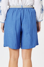 A model wearing the Lino Linen Blend Shorts in colour Sardinia (Blue), from the back