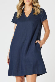 A model wearing the Delta Lino Linen Blend Dress in colour Navy (Blue), from the front, cropped image