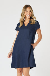 A model wearing the Delta Lino Linen Blend Dress in colour Navy (Blue), from the front, cropped image