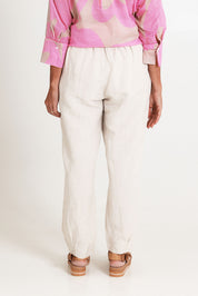 Model Sandy wearing size 10 of the Lino Linen Blend Tapered Pant in colour Natural, from the back