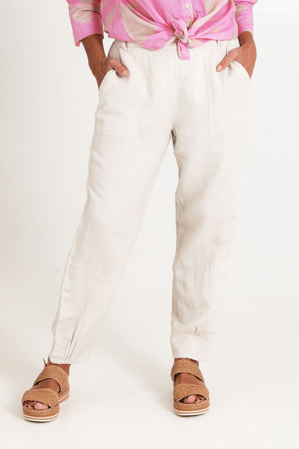 Model Sandy wearing size 10 of the Lino Linen Blend Tapered Pant in colour Natural, from the front, cropped image