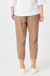 A model wearing the Lino Linen Blend Tapered Pant in colour Nutmeg, from the back