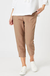 A model wearing the Lino Linen Blend Tapered Pant in colour Nutmeg, from the front, cropped image