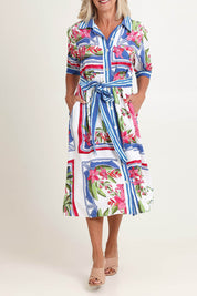 Model Sandy wearing size 10 of the Monaco Linen Blend Dress in colour Sardinia, from the front, cropped image