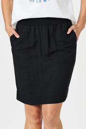 A model wearing the Lino Linen Blend Skirt in colour Black (Black), from the front, cropped image