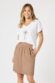 A model wearing the Lino Linen Blend Skirt in colour Nutmeg, from the front, cropped image