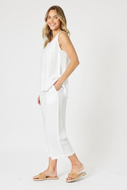 A model wearing the Lino Linen Blend Button Back Cami in colour White (White), from the front, showing the whole outfit