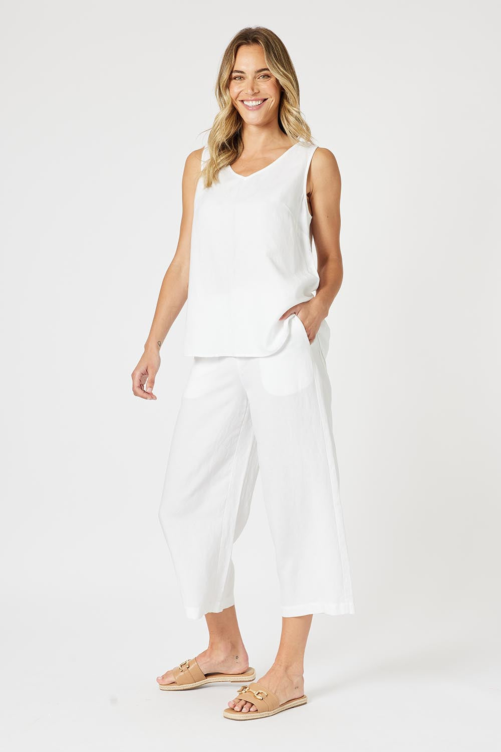 A model wearing the Lino Linen Blend Button Back Cami in colour White (White), from the front, showing the whole outfit