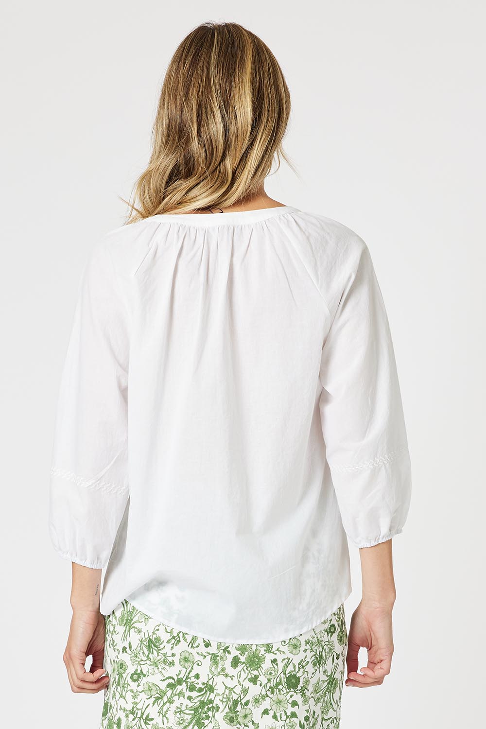 A model wearing the Coastal Embroidered Cotton Top in colour White (White), from the back