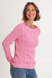 Model Riina wearing size S of the Hampton Cable Knit Jumper in colour Pink (Pink), from the front, cropped image
