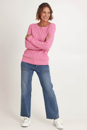 Model Riina wearing size S of the Hampton Cable Knit Jumper in colour Pink (Pink), from the front, showing the whole outfit